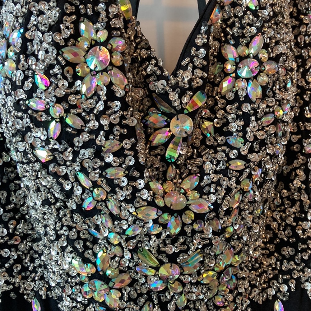 Long bejeweled black prom dress with thin straps and slit up to the thigh. - Picture 3 of 12
